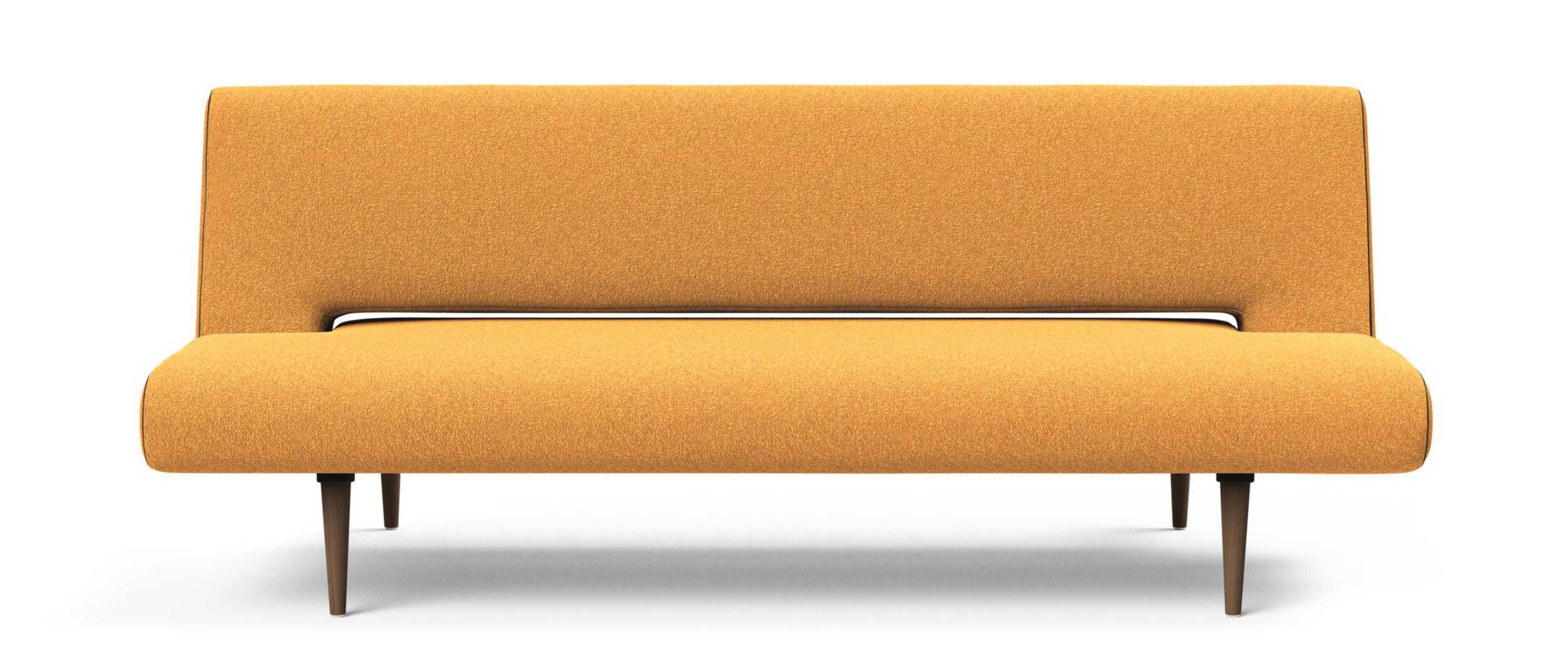 Das UNFURL Schlafsofa von Innovation mit dunkelbraun gebeizten Styletto Holzfüßen im Stoff Bouclé Ochre (536)