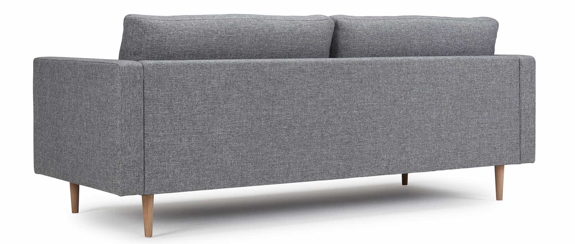 Der Rücken des TRONDHEIM Sofas ist immer in Ihrer Stoffauswahl bezogen