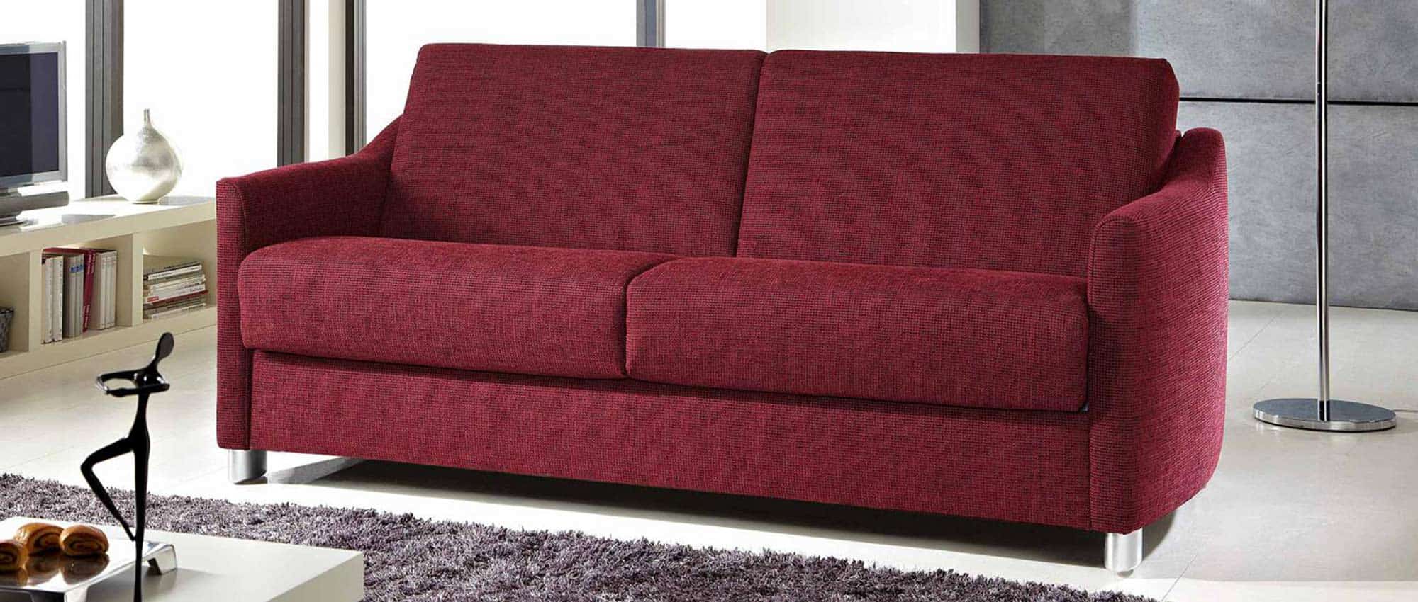 Das HAMBURG DELUXE Schlafsofa mit geschwungenen Armlehnen