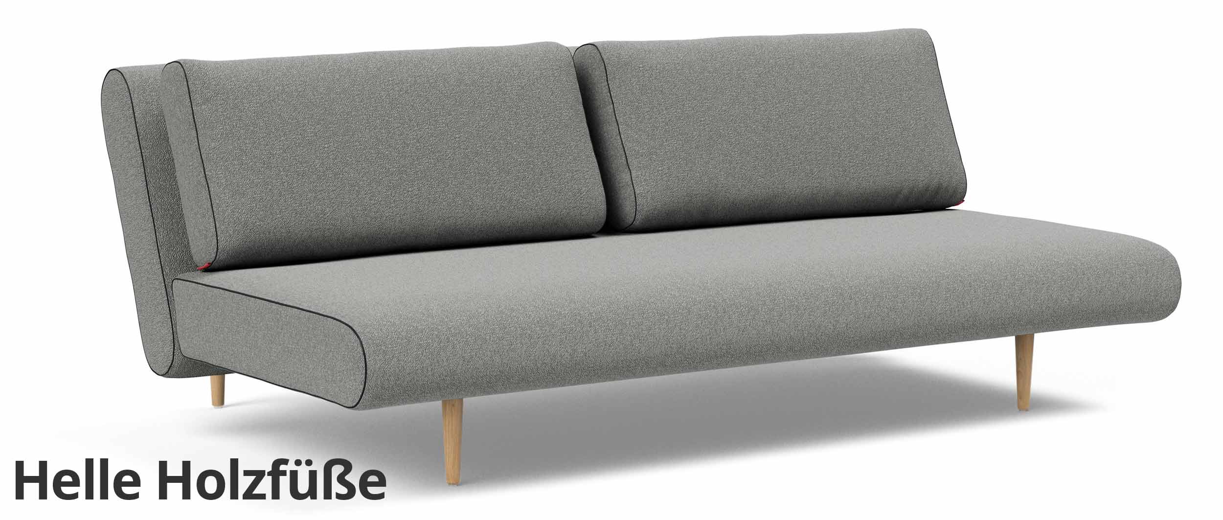 Das UNFURL LOUNGER Schlafsofa im grauen Stoff und mit hellen Styletto Holzfüßen (Sonderanfertigung)